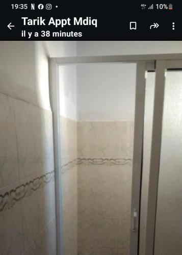 a screenshot of a bathroom with a glass shower door at Resicence jaouharat zarkaa in M'diq
