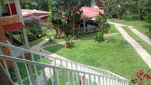 an aerial view of a yard with a white fence at Touristic House Chalet Luna Verde in Sasaima