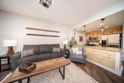 a living room with a couch and a table at Fraser Crossing 3309 in Winter Park