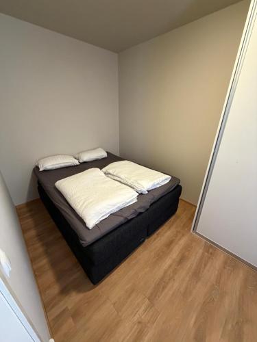 a bedroom with a bed in a small room at Spacious Retreat in Oslo