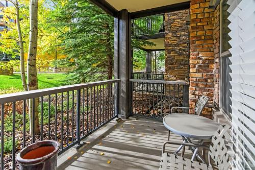 a screened porch with a table and chairs on it at Fraser Crossing 3127 in Winter Park