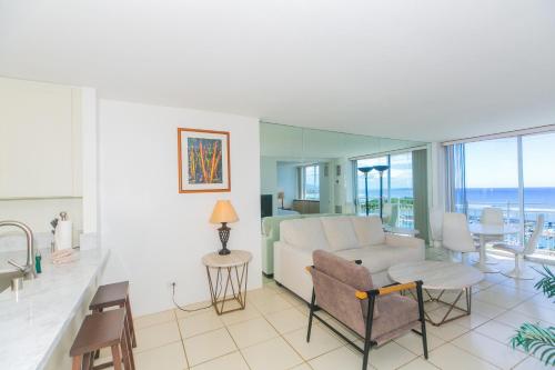 a living room with a couch and a table at Ilikai Marina 1688 in Honolulu