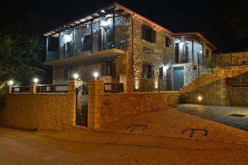 a house at night with lights on it at Gartagani Guest House in Stemnitsa