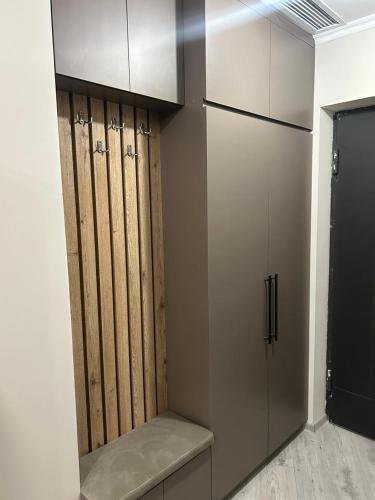 a closet with wooden doors in a room at Kechi home 6 in Tsaghkadzor