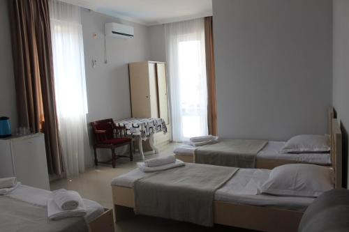 Llit o llits en una habitació de Hotel Niniko
