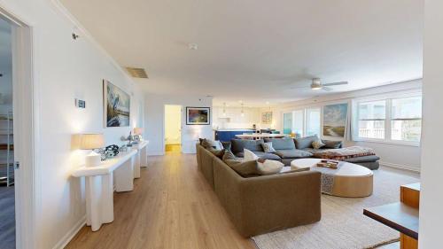 a living room with a couch and a table at Rehoboth Beach - 24 Brooklyn Ave Unit E in Rehoboth Beach