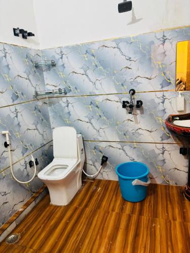 a bathroom with a toilet and a sink at Maa chamunda dham in Mathura