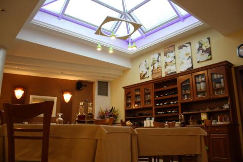 a dining room with a table and a skylight at Italia Risorta in Arsiero