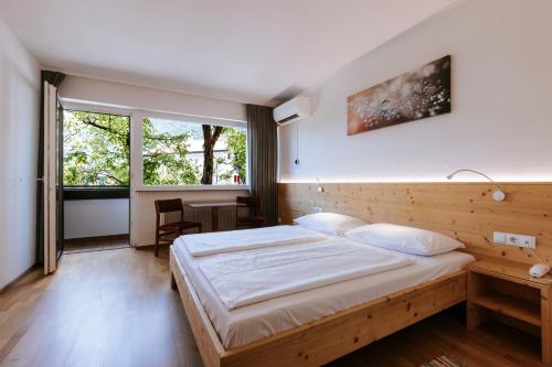 Llit o llits en una habitació de Bio Hotel Kaufmann