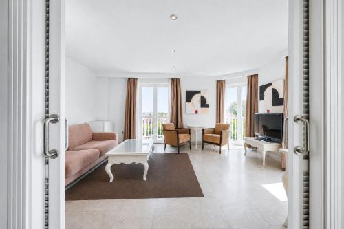 a living room with a couch and a table at Gran Hotel Suances in Suances