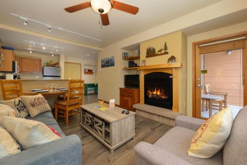 a living room with a couch and a fireplace at Zephyr Mountain Lodge Unit 1306 in Winter Park
