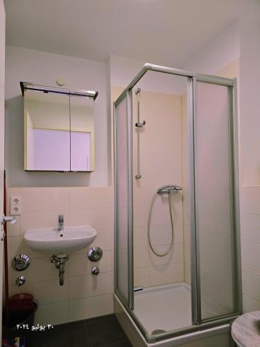 a bathroom with a shower and a sink at Nürnberg Nähe Studio in Fürth