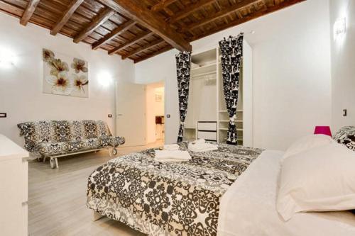 Lova arba lovos apgyvendinimo įstaigoje Casa Vacanze Colosseum by Serena