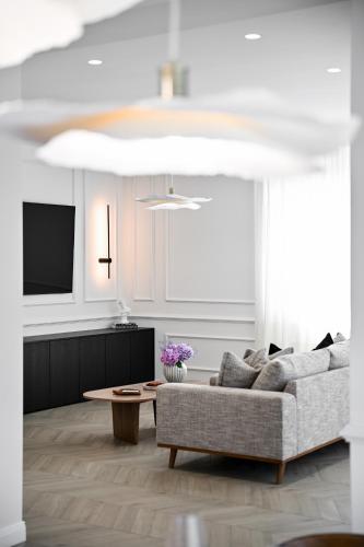 a living room with a couch and a table at Casa Magista in Sukošan