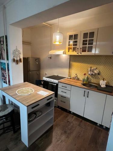 a kitchen with a island in the middle of it at Rio II in Zrenjanin