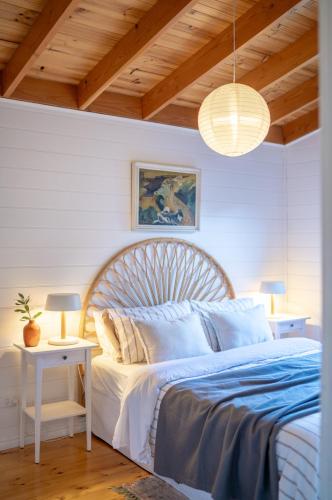 a bedroom with a large bed with a blue comforter at The Heights in St Helens