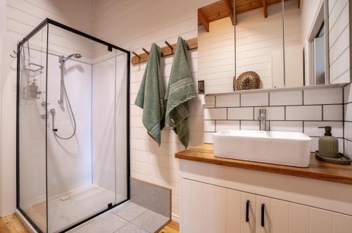 a bathroom with a sink and a shower at The Heights in St Helens
