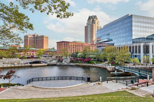a city skyline with a pond and buildings at Courtyard Providence Downtown in Providence