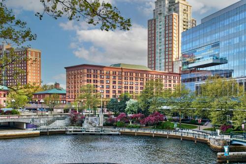 a bridge over a river in a city with tall buildings at Courtyard Providence Downtown in Providence