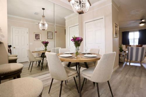 a dining room with a table and chairs at Stylish Sanctuary King Beds Upscale Condo in Gainesville