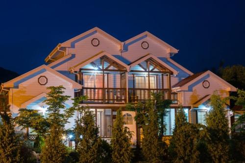 a large house at night with its lights on at Milyang Sweety Pension in Miryang