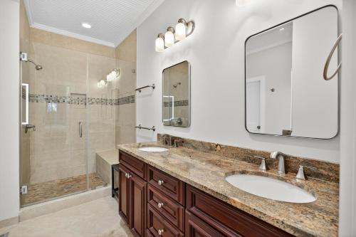 a bathroom with two sinks and a shower at SS3512: 3512 Seascape in Kiawah Island