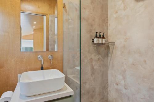 a bathroom with a sink and a shower at Ralph Escapes Yallingup in Yallingup