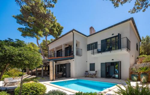 an exterior view of a house with a swimming pool at Villa Ana in Jelsa