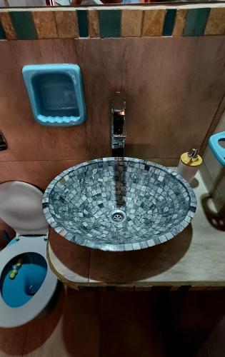 a bathroom with a sink and a toilet at Mallma Cabañas in Tilcara
