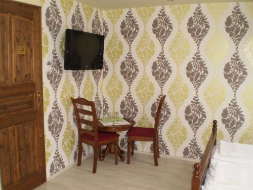 TV a/nebo společenská místnost v ubytování Mosoly Apartman