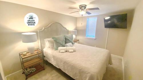 a bedroom with a bed and a ceiling fan at Red Bank Cozy Nest in Chattanooga