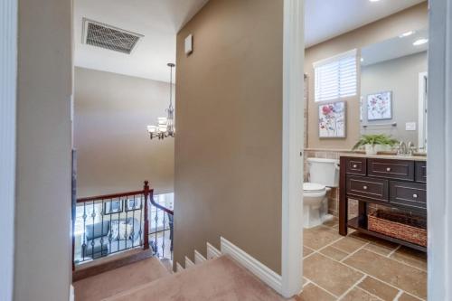 a bathroom with a toilet and a sink at Beautiful Backyard Oasis 5 bedroom 3 Bathroom Home in Placentia