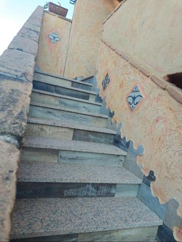 a set of stairs leading up to a building at Casa Gaudi - House & Rooms in Teulada
