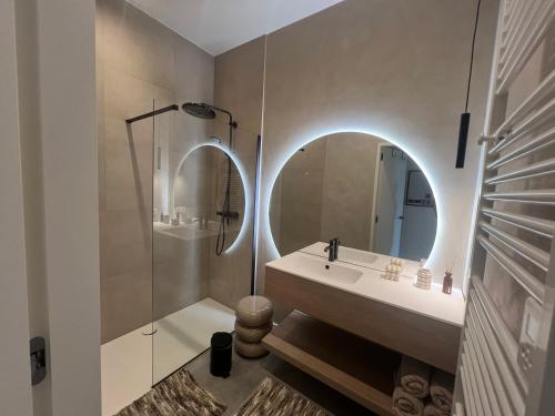 a bathroom with a sink and a mirror at Villa Rive in Ostend