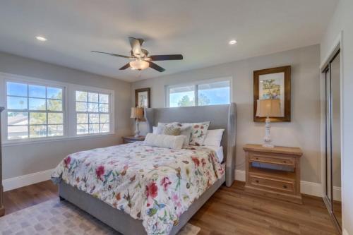a bedroom with a bed and a ceiling fan at Gorgeous Upgraded 5 Bedroom & 3 Bath Home with pool in Orange