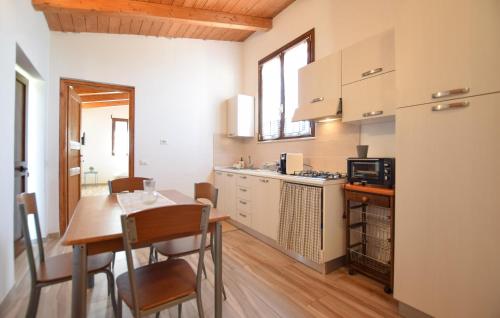 a kitchen with a table and a dining room at Umbria Montefranco in Montefranco