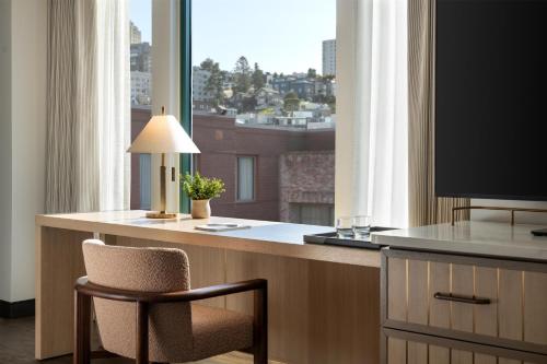 a room with a desk with a television and a chair at Hyatt Centric Fisherman's Wharf San Francisco in San Francisco