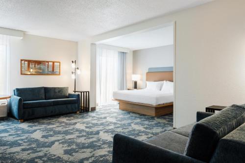 a hotel room with a bed and a bedroom at Hampton Inn Harbourgate in Myrtle Beach