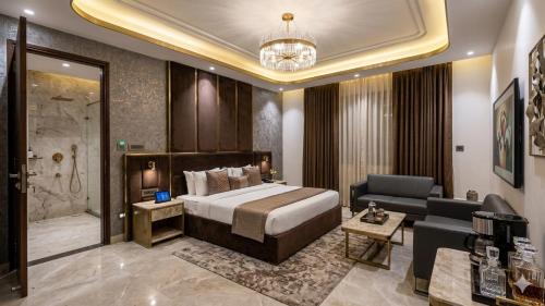 a hotel room with a bed and a bathroom at Hotel Preeti Residency Delhi in New Delhi