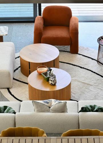 a living room with a couch and a chair at Architect-Designed Villa with Heated Indoor Pool in Oslip