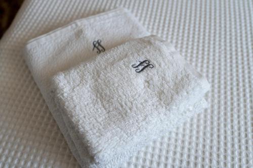 a white cloth napkin with the word faith on it at Swimming Pool - Valley View Home Drobonik in Drobonik