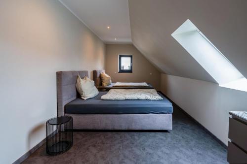 a bedroom with a bed in the middle of a staircase at Lara Prime in Zepkow