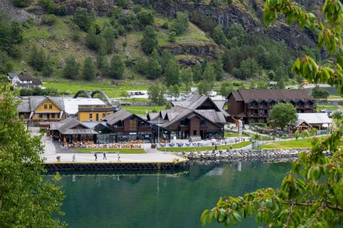 a town next to a body of water with buildings at Flåmsbrygga Hotel in Flåm