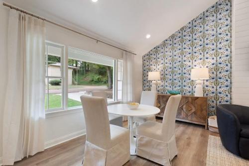 a dining room with a table and chairs and a window at Family Friendly 4BR Oxford Home Near The Square in Oxford
