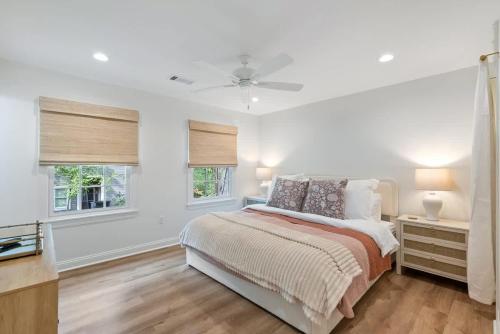 a white bedroom with a bed and two windows at Family Friendly 4BR Oxford Home Near The Square in Oxford