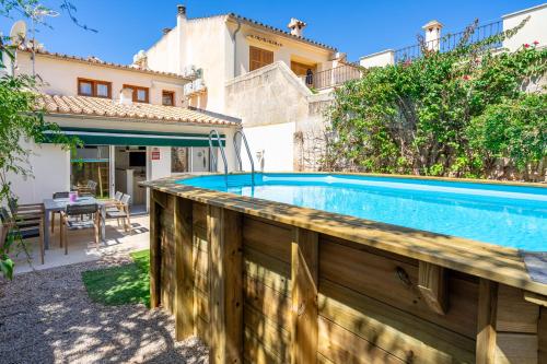 a swimming pool in the backyard of a house at Sant Antoni 39 in Llucmajor