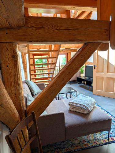 a living room with a couch in a log cabin at tobel 1853 apartments in Leutkirch im Allgäu