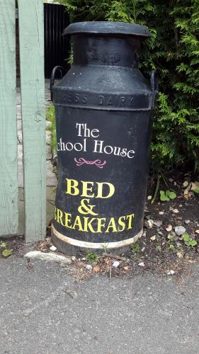 a black trash can with the words the school house bed and breakfast on it at The School House in Warrington