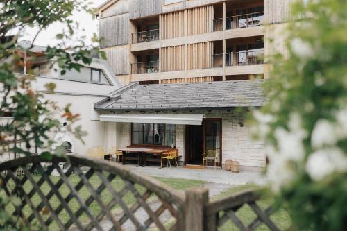 a patio with a table and a building at City Bungalow in Schladming