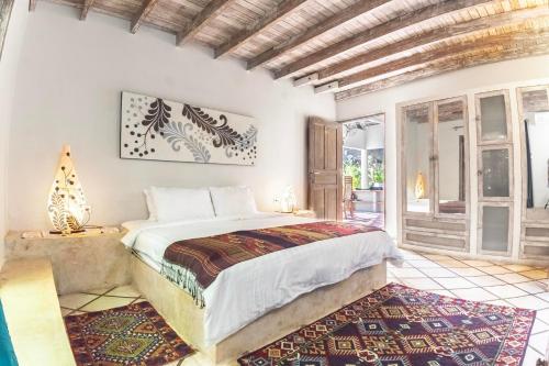 a bedroom with a bed in a room at Villa Raquel by Betterplace in Seminyak